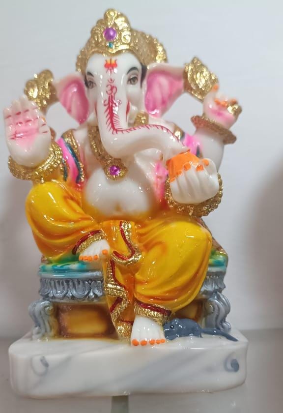 Ganesha statue, likely made of marble or marble dust.